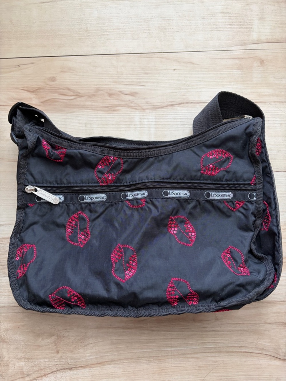 LeSportsac Black Crossbody Bag with Red Lip Print
